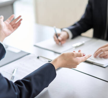 Hand of a business woman giving an explanation at a meeting Hand of a business woman giving an explanation at a meeting